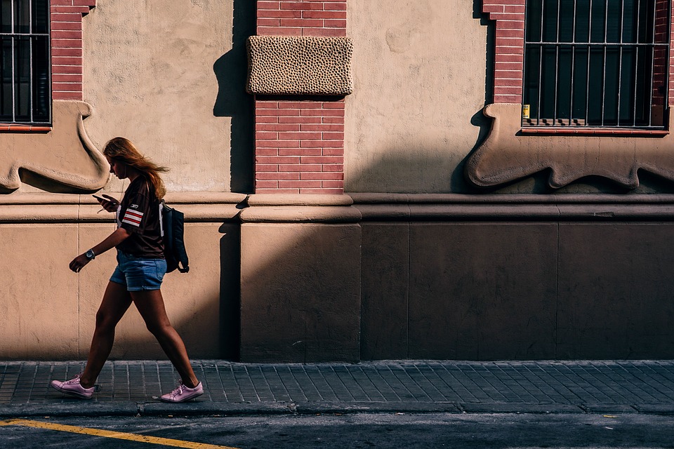 woman walking with phone