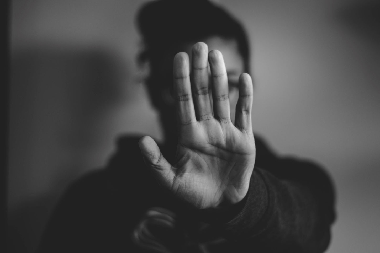 hand in front of face