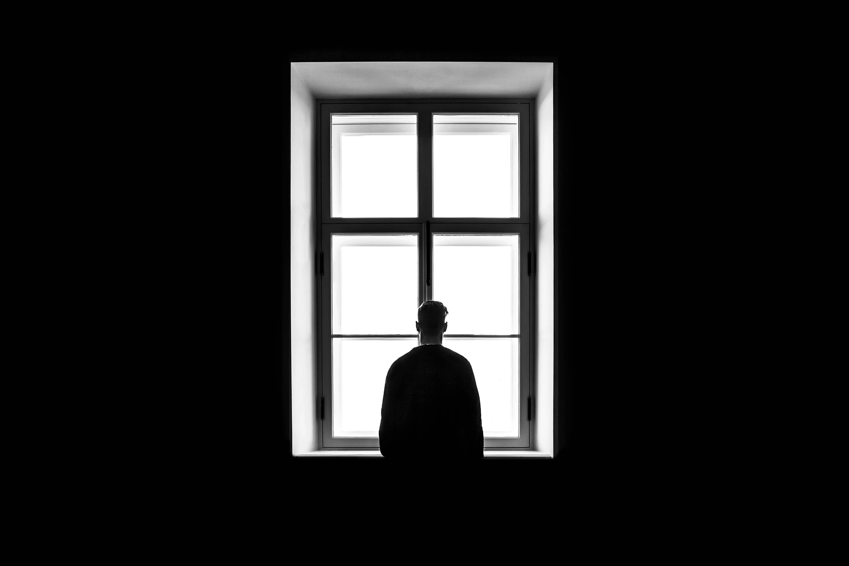Man staring at the window