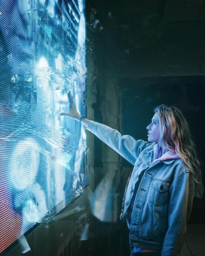 Woman touching a digital wall