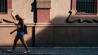 woman walking with phone