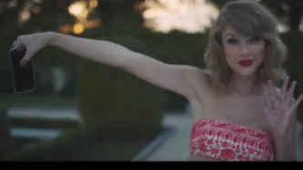 Taylor swift holding a phone (from the videoclip)