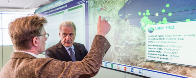 Dirk Vande Ryse, Head of the Frontex Situation Centre (FSC), on the left, giving explanations to Dimitris Avramopoulos, next to the screen of the FSC