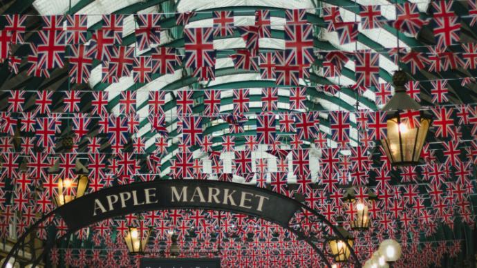 An apple market covered with hundreds of British Flags