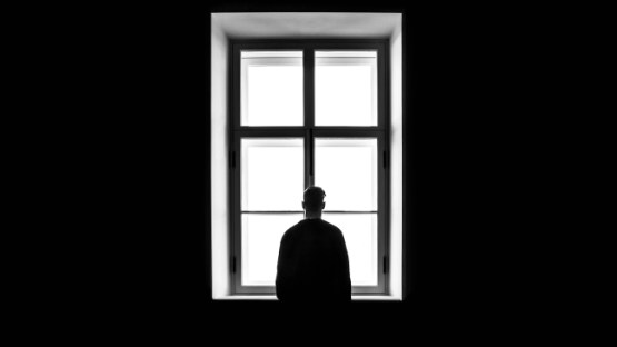 Man staring at the window
