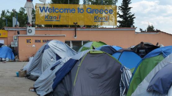 Tents and sign "Welcome to Greece"