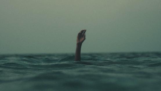 Hand in sea drowning