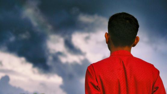 Man looking into the sky.