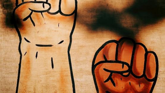 Drawing of two brandished fists