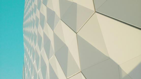 a close up of a building with a blue sky in the background