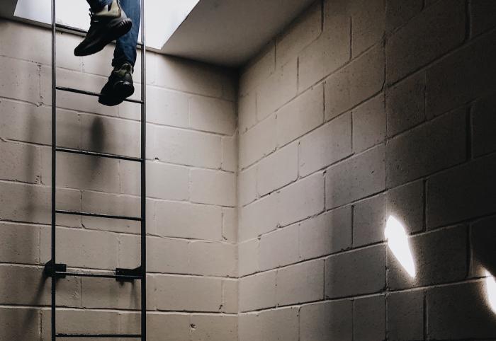 person climbing ladder