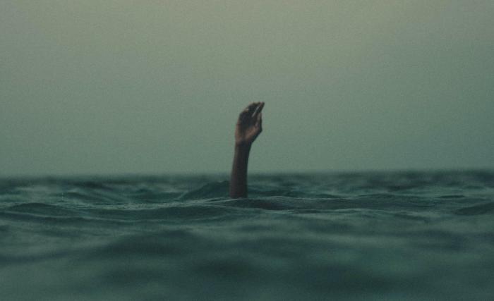 Hand in sea drowning