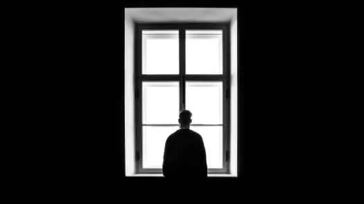 Man staring at the window