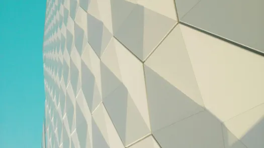 a close up of a building with a blue sky in the background