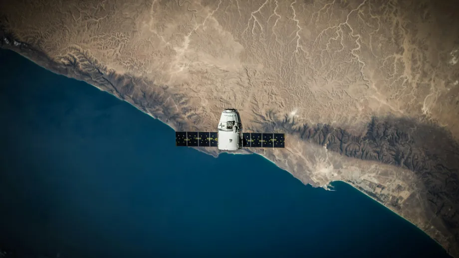A satellite hovering above the coastline. 