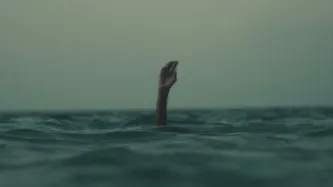 Hand in sea drowning