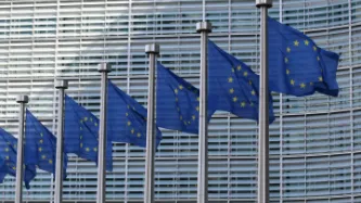 European Union flags in front of European Commission building