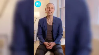 Jason Domino, sex worker and content creator, sitting on a chair facing the camera